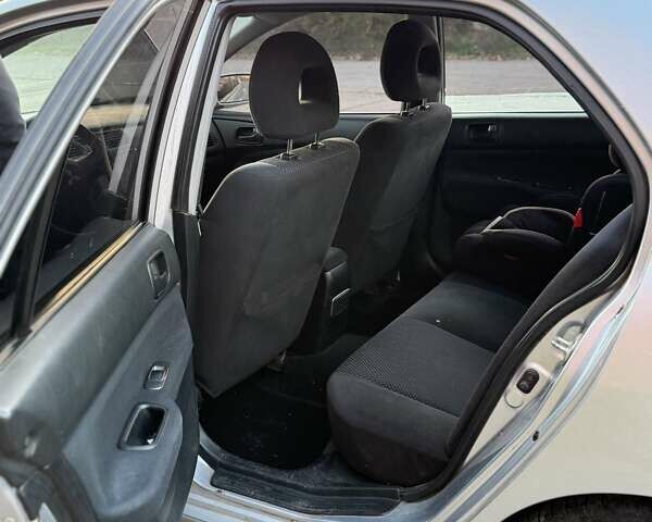 Серый Мицубиси Лансер, объемом двигателя 1.58 л и пробегом 145 тыс. км за 4800 $, фото 3 на Automoto.ua