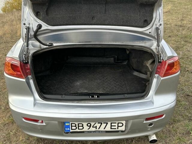 Серый Мицубиси Лансер, объемом двигателя 1.5 л и пробегом 321 тыс. км за 3900 $, фото 6 на Automoto.ua