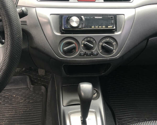Сірий Міцубісі Lancer, об'ємом двигуна 1.58 л та пробігом 240 тис. км за 4299 $, фото 17 на Automoto.ua