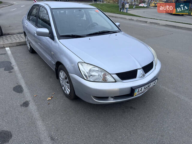 Серый Мицубиси Лансер, объемом двигателя 1.58 л и пробегом 330 тыс. км за 3500 $, фото 1 на Automoto.ua