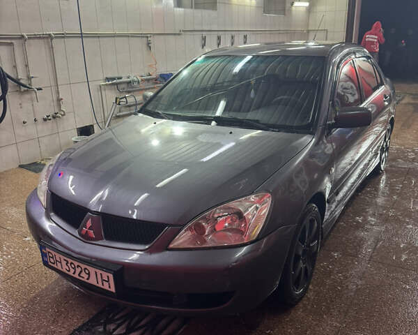Серый Мицубиси Лансер, объемом двигателя 1.6 л и пробегом 268 тыс. км за 4600 $, фото 2 на Automoto.ua