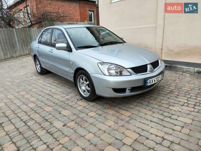 Серый Мицубиси Лансер, объемом двигателя 1.58 л и пробегом 185 тыс. км за 4700 $, фото 1 на Automoto.ua