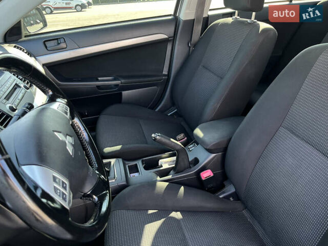 Сірий Міцубісі Lancer, об'ємом двигуна 2 л та пробігом 237 тис. км за 7200 $, фото 29 на Automoto.ua