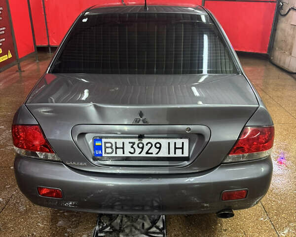 Серый Мицубиси Лансер, объемом двигателя 1.6 л и пробегом 268 тыс. км за 4600 $, фото 5 на Automoto.ua