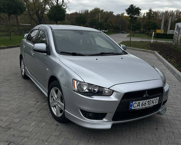 Серый Мицубиси Лансер, объемом двигателя 2 л и пробегом 211 тыс. км за 7100 $, фото 4 на Automoto.ua