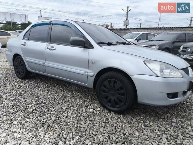 Сірий Міцубісі Lancer, об'ємом двигуна 1.6 л та пробігом 240 тис. км за 2999 $, фото 6 на Automoto.ua