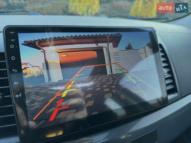 Сірий Міцубісі Lancer, об'ємом двигуна 2 л та пробігом 92 тис. км за 9800 $, фото 38 на Automoto.ua