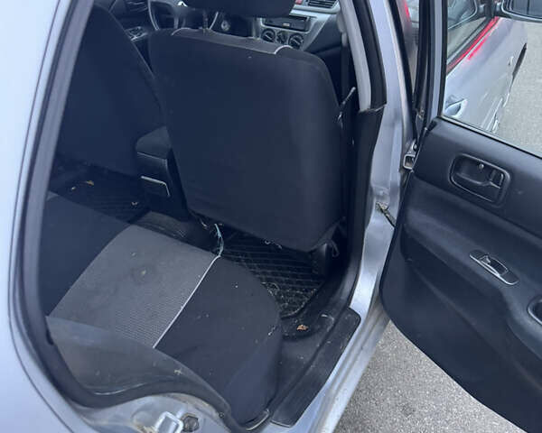 Серый Мицубиси Лансер, объемом двигателя 1.58 л и пробегом 330 тыс. км за 3500 $, фото 11 на Automoto.ua