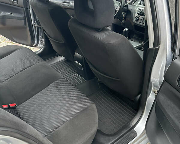 Сірий Міцубісі Lancer, об'ємом двигуна 1.59 л та пробігом 219 тис. км за 4500 $, фото 16 на Automoto.ua