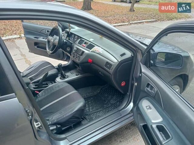 Серый Мицубиси Лансер, объемом двигателя 1.58 л и пробегом 205 тыс. км за 3300 $, фото 9 на Automoto.ua