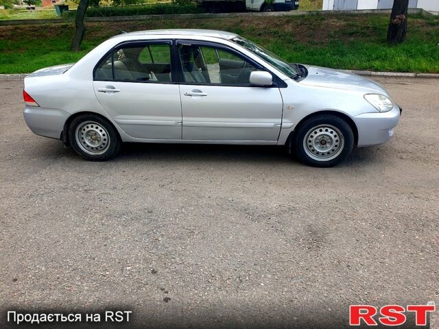 Серый Мицубиси Лансер, объемом двигателя 1.6 л и пробегом 98 тыс. км за 6200 $, фото 1 на Automoto.ua