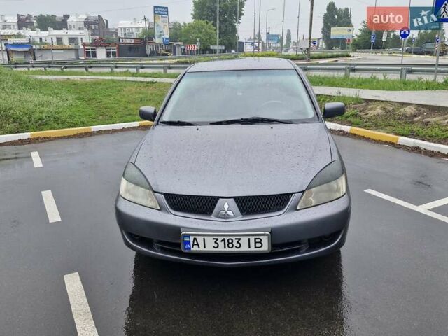 Сірий Міцубісі Lancer, об'ємом двигуна 1.58 л та пробігом 245 тис. км за 2650 $, фото 1 на Automoto.ua