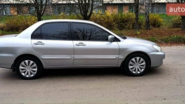 Серый Мицубиси Лансер, объемом двигателя 1.58 л и пробегом 176 тыс. км за 5000 $, фото 9 на Automoto.ua