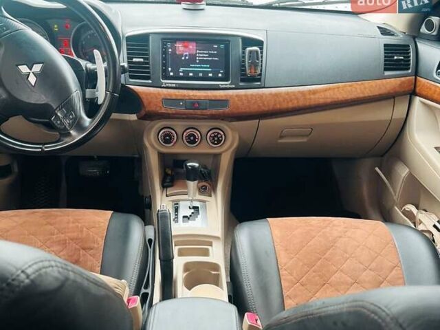 Сірий Міцубісі Lancer, об'ємом двигуна 2 л та пробігом 213 тис. км за 7300 $, фото 13 на Automoto.ua