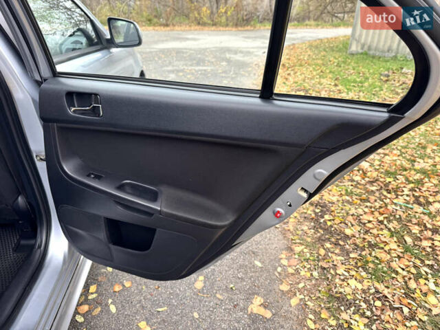 Сірий Міцубісі Lancer, об'ємом двигуна 2 л та пробігом 225 тис. км за 6890 $, фото 14 на Automoto.ua