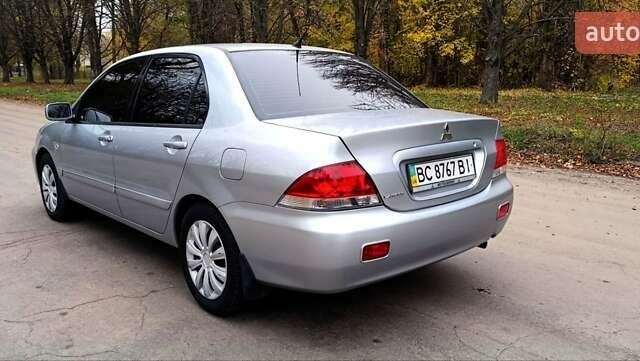 Серый Мицубиси Лансер, объемом двигателя 1.58 л и пробегом 176 тыс. км за 5000 $, фото 10 на Automoto.ua