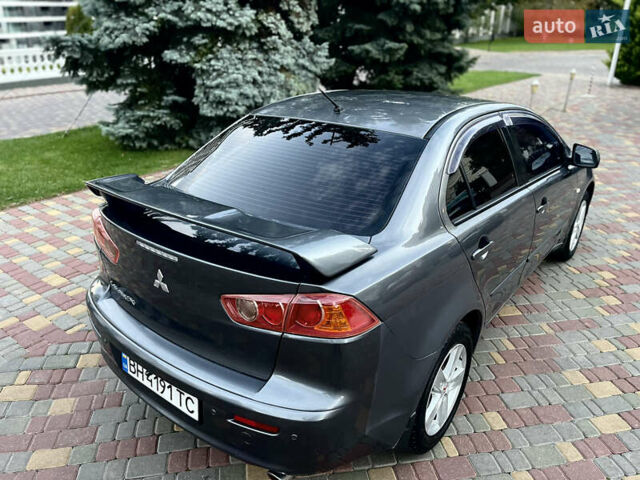 Серый Мицубиси Лансер, объемом двигателя 2 л и пробегом 212 тыс. км за 6000 $, фото 9 на Automoto.ua