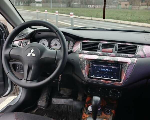 Сірий Міцубісі Lancer, об'ємом двигуна 1.6 л та пробігом 225 тис. км за 5200 $, фото 11 на Automoto.ua