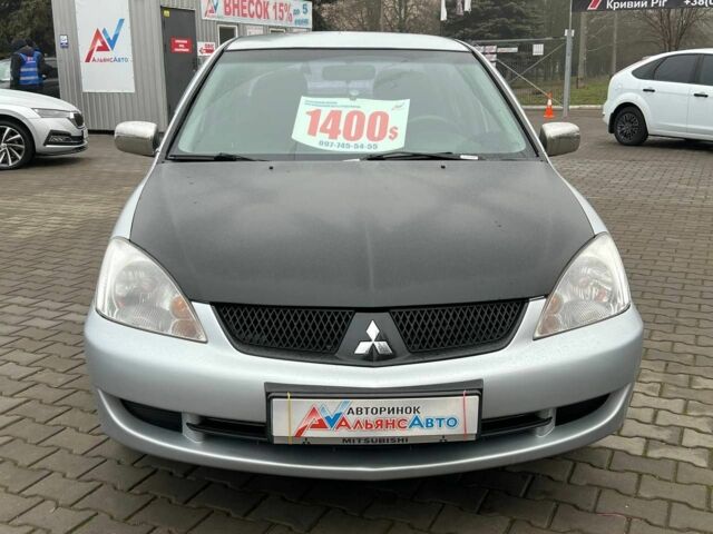 Серый Мицубиси Лансер, объемом двигателя 1.6 л и пробегом 205 тыс. км за 5400 $, фото 1 на Automoto.ua