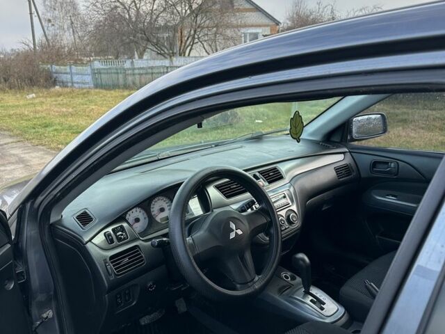 Серый Мицубиси Лансер, объемом двигателя 1.6 л и пробегом 114 тыс. км за 4000 $, фото 6 на Automoto.ua