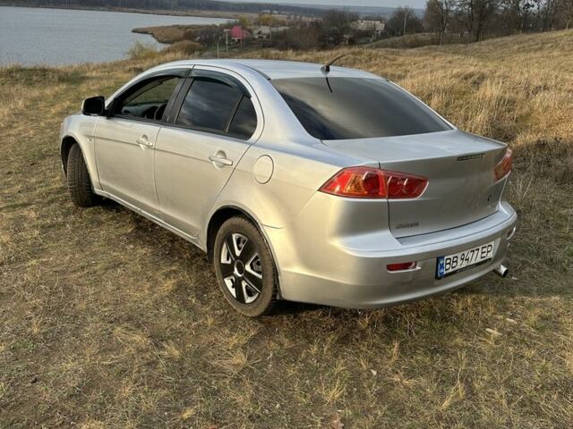 Серый Мицубиси Лансер, объемом двигателя 1.5 л и пробегом 321 тыс. км за 3900 $, фото 3 на Automoto.ua