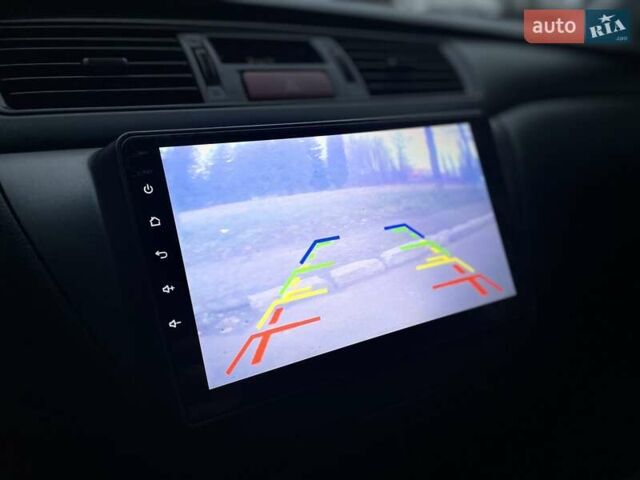 Сірий Міцубісі Lancer, об'ємом двигуна 1.6 л та пробігом 254 тис. км за 3800 $, фото 22 на Automoto.ua