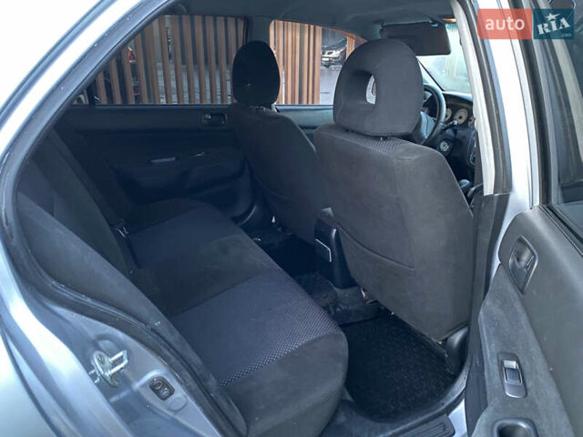 Серый Мицубиси Лансер, объемом двигателя 1.6 л и пробегом 203 тыс. км за 5200 $, фото 6 на Automoto.ua