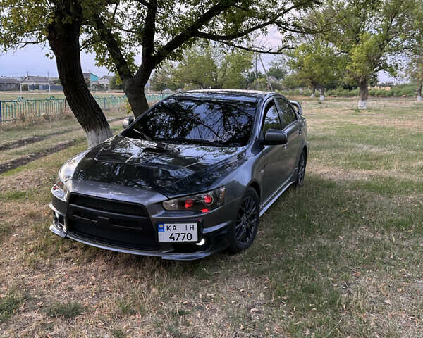 Серый Мицубиси Лансер, объемом двигателя 1.5 л и пробегом 255 тыс. км за 6000 $, фото 1 на Automoto.ua