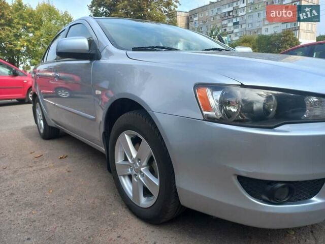 Серый Мицубиси Лансер, объемом двигателя 2 л и пробегом 103 тыс. км за 7700 $, фото 5 на Automoto.ua