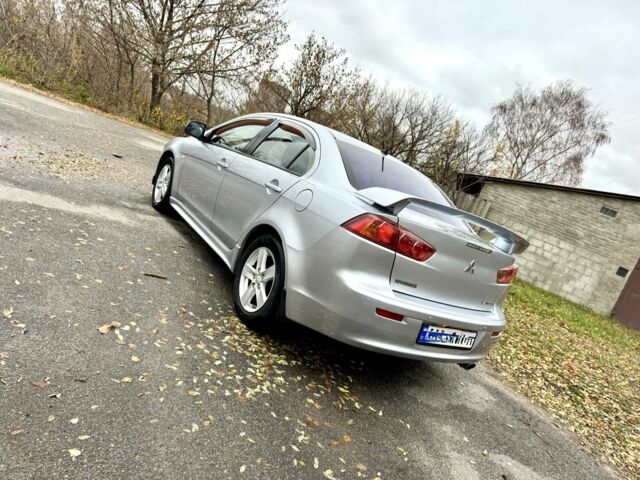 Серый Мицубиси Лансер, объемом двигателя 2 л и пробегом 225 тыс. км за 6890 $, фото 4 на Automoto.ua