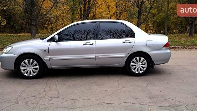 Серый Мицубиси Лансер, объемом двигателя 1.58 л и пробегом 176 тыс. км за 5000 $, фото 11 на Automoto.ua