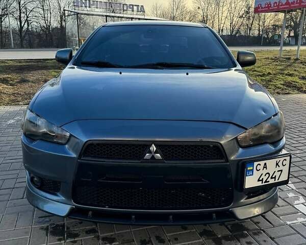 Серый Мицубиси Лансер, объемом двигателя 2 л и пробегом 220 тыс. км за 6800 $, фото 2 на Automoto.ua
