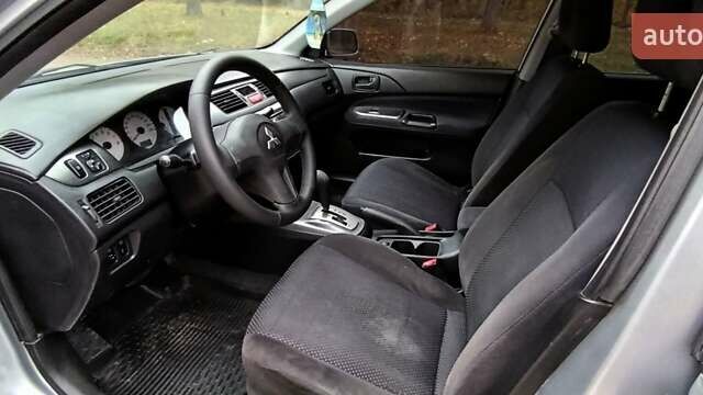 Серый Мицубиси Лансер, объемом двигателя 1.58 л и пробегом 176 тыс. км за 5000 $, фото 16 на Automoto.ua