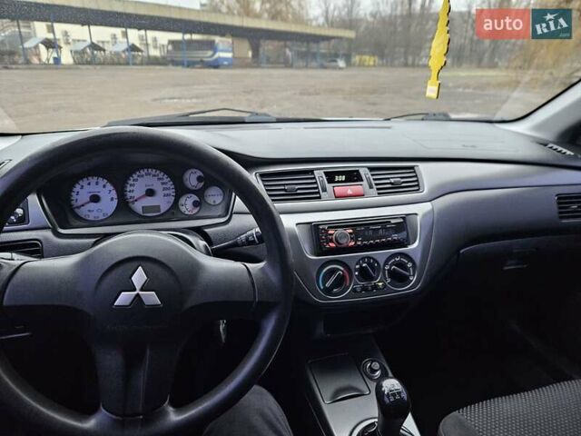 Сірий Міцубісі Lancer, об'ємом двигуна 1.58 л та пробігом 76 тис. км за 4500 $, фото 29 на Automoto.ua
