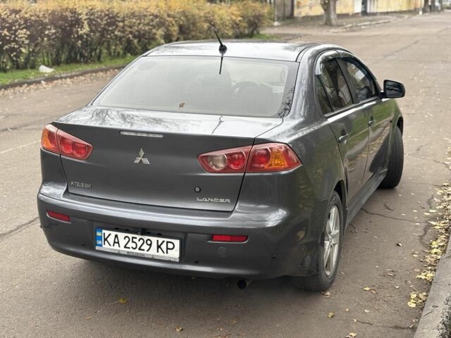 Серый Мицубиси Лансер, объемом двигателя 2 л и пробегом 240 тыс. км за 5450 $, фото 1 на Automoto.ua