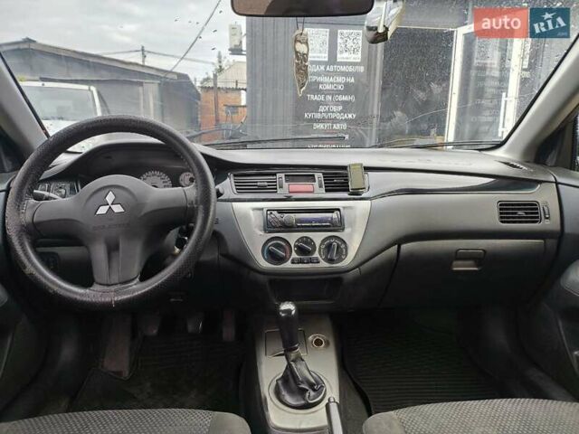 Сірий Міцубісі Lancer, об'ємом двигуна 1.6 л та пробігом 240 тис. км за 2999 $, фото 1 на Automoto.ua
