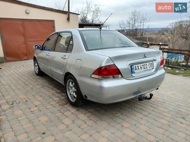 Серый Мицубиси Лансер, объемом двигателя 1.58 л и пробегом 185 тыс. км за 4700 $, фото 7 на Automoto.ua
