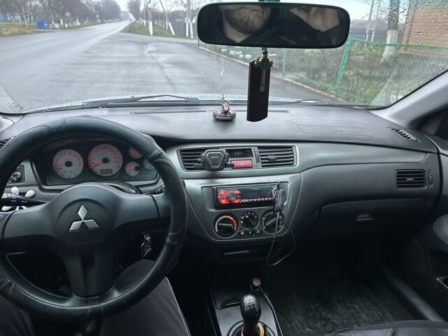 Сірий Міцубісі Lancer, об'ємом двигуна 1.6 л та пробігом 222 тис. км за 4300 $, фото 7 на Automoto.ua