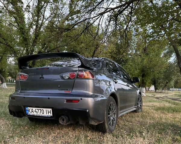 Серый Мицубиси Лансер, объемом двигателя 1.5 л и пробегом 255 тыс. км за 6000 $, фото 4 на Automoto.ua