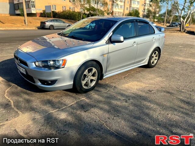 Серый Мицубиси Лансер, объемом двигателя 2 л и пробегом 151 тыс. км за 6099 $, фото 1 на Automoto.ua