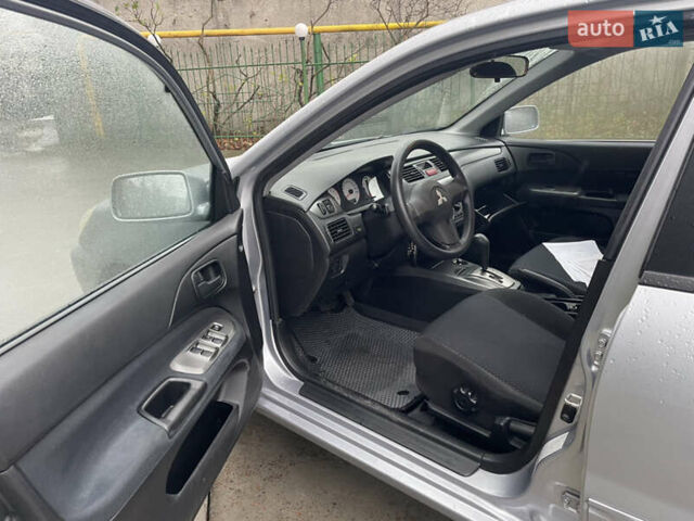 Сірий Міцубісі Lancer, об'ємом двигуна 1.58 л та пробігом 220 тис. км за 5900 $, фото 18 на Automoto.ua