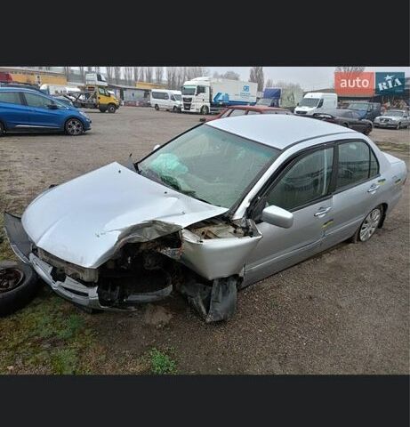 Серый Мицубиси Лансер, объемом двигателя 1.6 л и пробегом 260 тыс. км за 1200 $, фото 1 на Automoto.ua