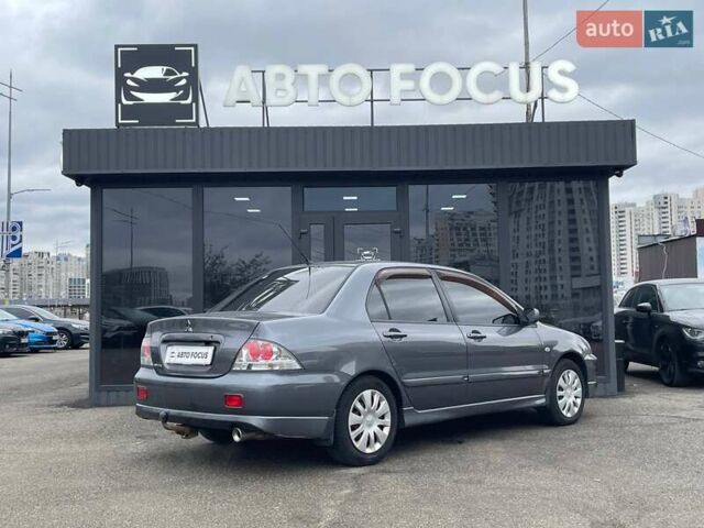 Серый Мицубиси Лансер, объемом двигателя 1.58 л и пробегом 146 тыс. км за 5490 $, фото 7 на Automoto.ua