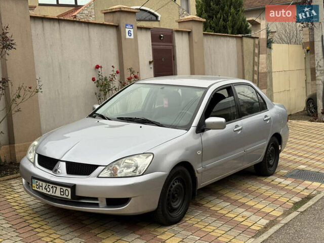 Сірий Міцубісі Lancer, об'ємом двигуна 1.6 л та пробігом 221 тис. км за 3650 $, фото 3 на Automoto.ua