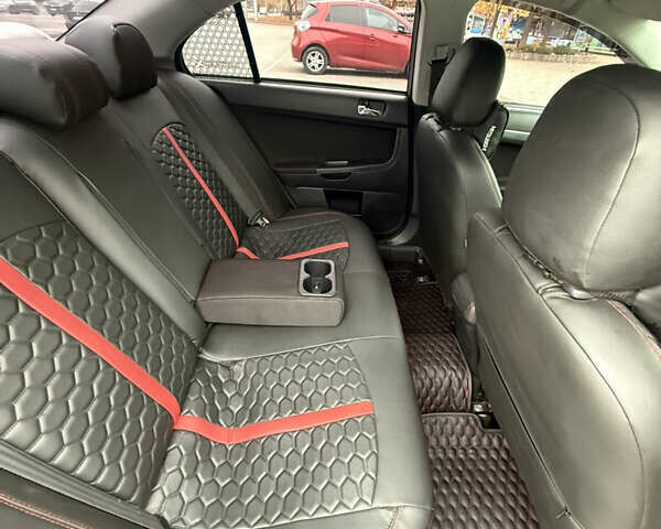 Сірий Міцубісі Lancer, об'ємом двигуна 2 л та пробігом 253 тис. км за 8700 $, фото 2 на Automoto.ua