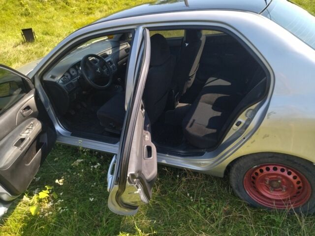 Серый Мицубиси Лансер, объемом двигателя 1.6 л и пробегом 350 тыс. км за 3600 $, фото 3 на Automoto.ua