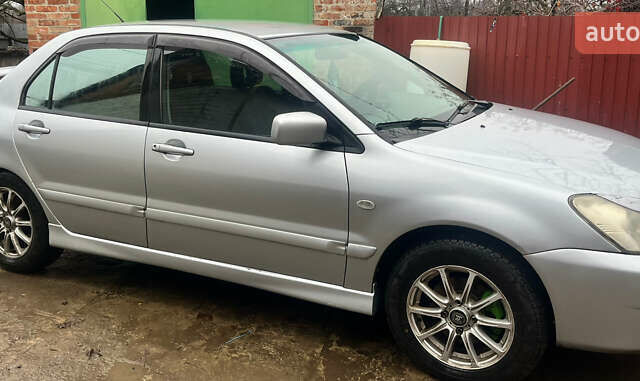 Серый Мицубиси Лансер, объемом двигателя 1.6 л и пробегом 282 тыс. км за 4699 $, фото 1 на Automoto.ua