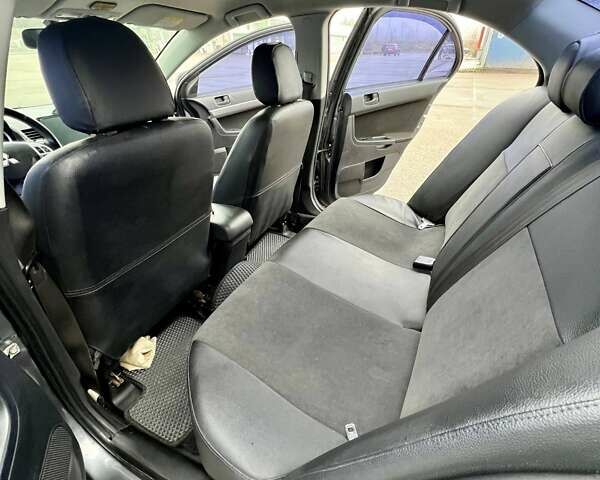 Серый Мицубиси Лансер, объемом двигателя 2 л и пробегом 203 тыс. км за 4999 $, фото 11 на Automoto.ua