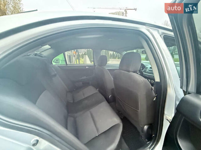 Серый Мицубиси Лансер, объемом двигателя 2 л и пробегом 220 тыс. км за 6500 $, фото 5 на Automoto.ua