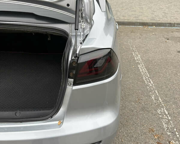Сірий Міцубісі Lancer, об'ємом двигуна 2 л та пробігом 253 тис. км за 8700 $, фото 22 на Automoto.ua